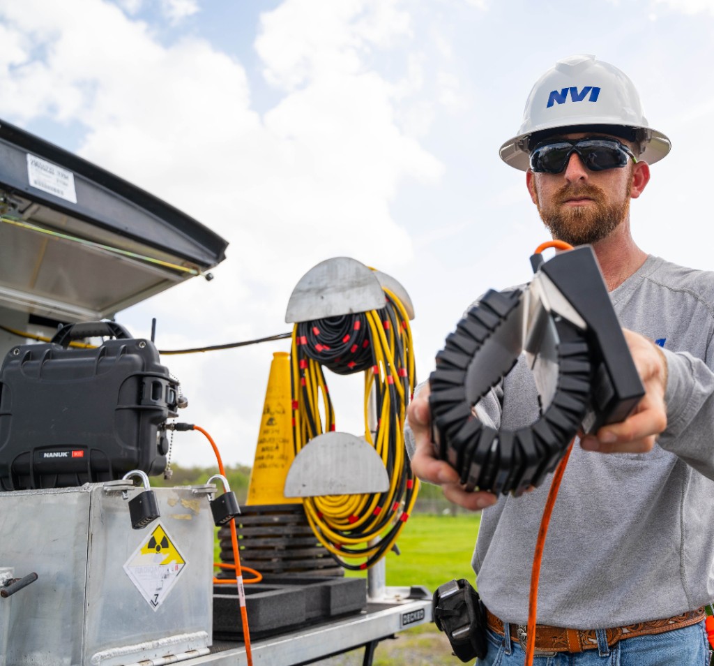 NVI technician holding flexible digital detector panel