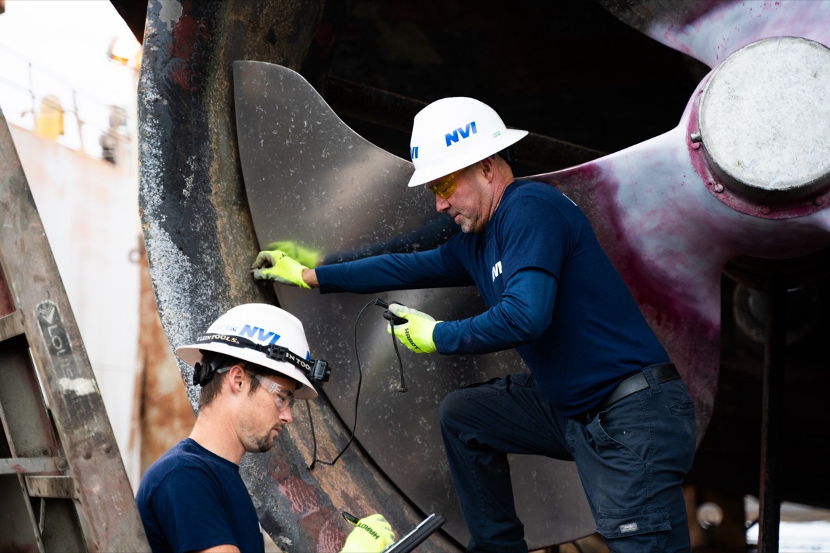 NVI technicians inspecting a ship propeller